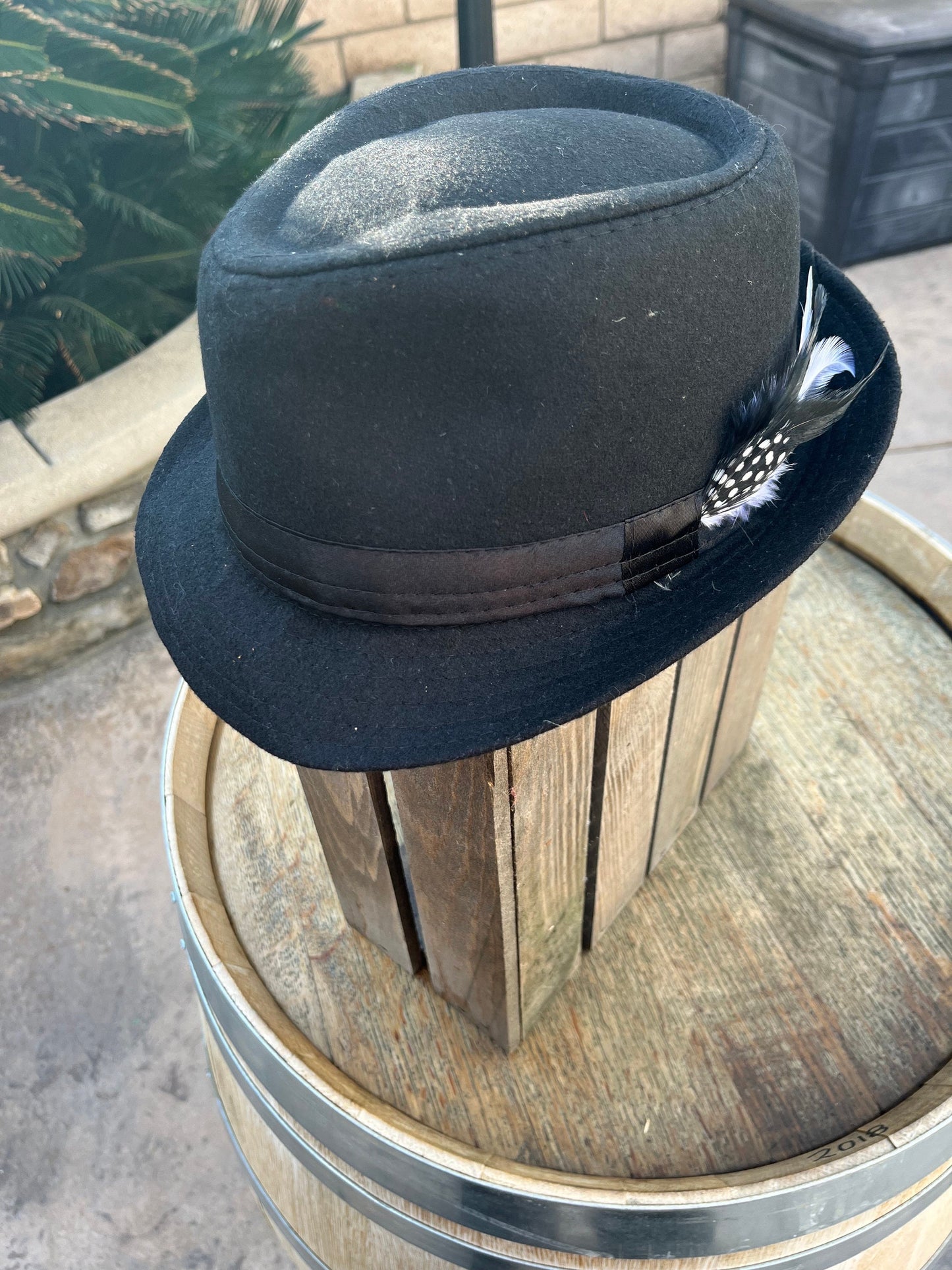 Men’s/unisex black fedora satin band with red, black, and white feather