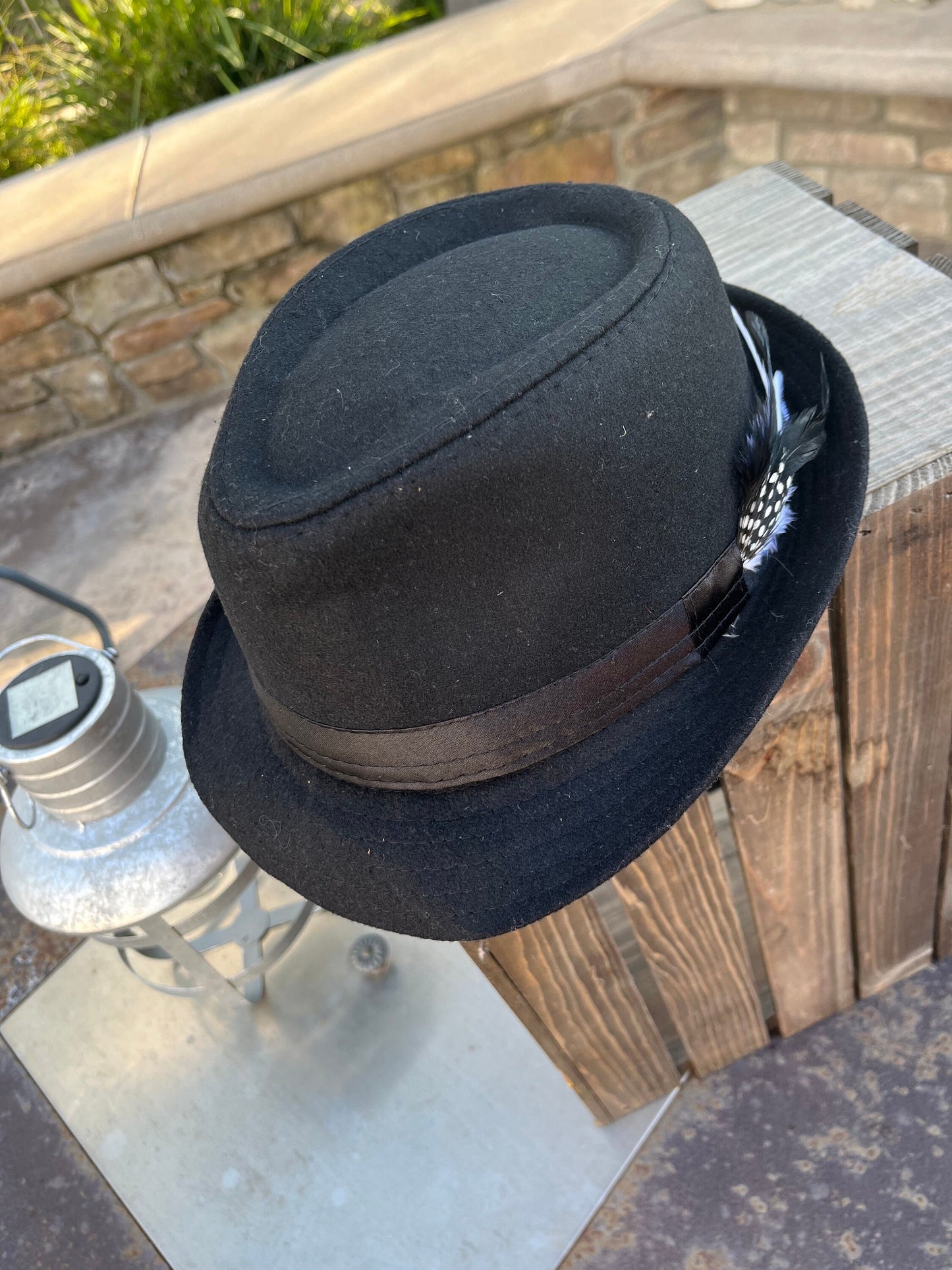 Men’s/unisex black fedora satin band with red, black, and white feather