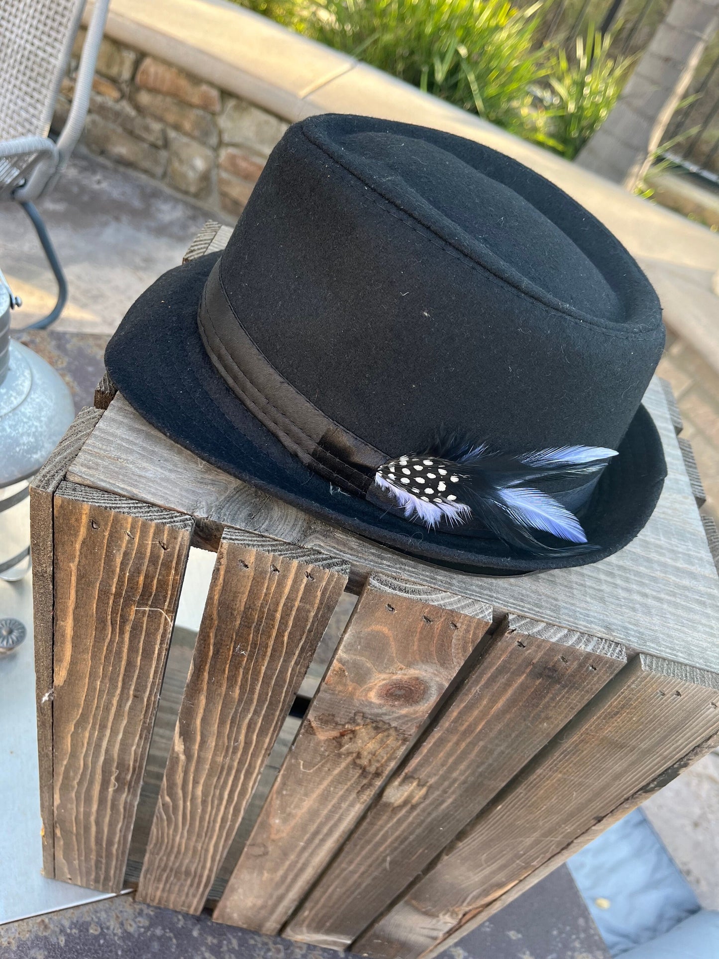Men’s/unisex black fedora satin band with red, black, and white feather